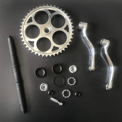 44T Wide Crank Assembly Kit for Gas Motorized Bicycle, 3 Piece Set, Fits 26 Inch Cruiser Frames, parts laid out on black surface