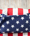 Cozy Hammock Chair With Armrest Support Indoor Outdoor Rope Swing 12 Pattern Options Breathable Fabric Red White And Blue Colorway Ideal For Reading Lounging And Relaxing showing star and stripe cushion detail