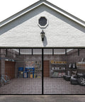 Magnetic Garage Door Screen 8 By 7 Ft For One Car, Reinforced Fiberglass Mesh installed on a garage, showing interior with tools and tires.