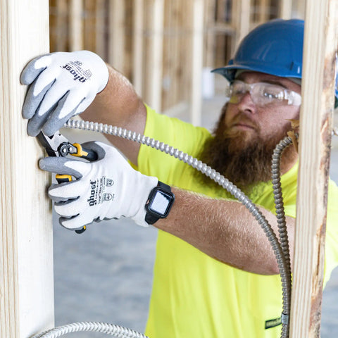 Worker wearing Ghost Series Cut Protection Level 2 Work Gloves For Industrial Use, Large, Multi Color, handling wiring.