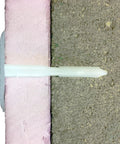 Rock Solid White Plastic Insulation Anchors 250 Pack Heavy Duty Fasteners for Masonry Brick Concrete Stone Walls, installed in foam.