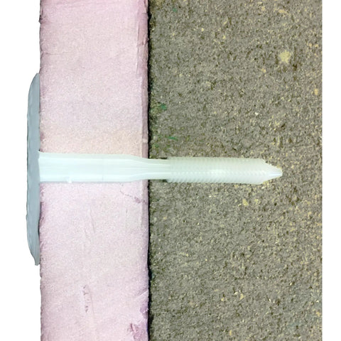 Rock Solid White Plastic Insulation Anchors 250 Pack Heavy Duty Fasteners for Masonry Brick Concrete Stone Walls, installed in foam.