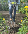 Gardener using Beefy Stainless Steel Digging Fork For Heavy Duty Garden Work, Durable Garden Tool For Digging in vegetable bed
