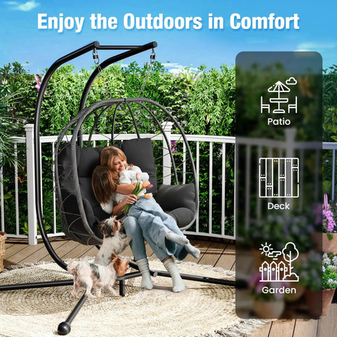 Woman and child sitting on Heavy Duty 700 Lb Double Egg Chair with Stand for Indoor or Outdoor Use, enjoying sunny garden view.