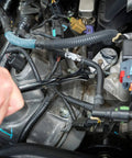 Hand using Three Eighth Inch Drive Ratchet And Drive Tools Set With Eighty Four Tooth Full Polish Chrome Ratchets on engine bolts