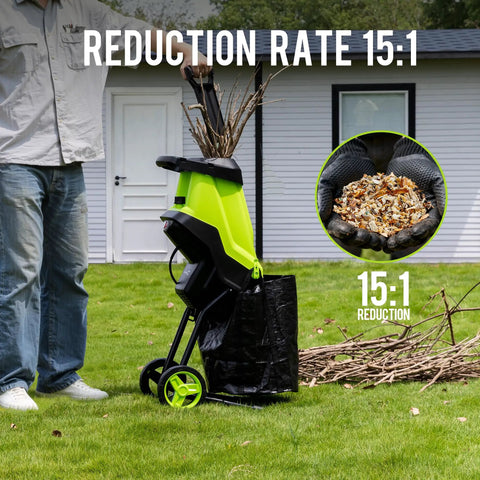 Person using Powerful 15 Amp Electric Wood Chipper And Mulcher For Yard Work With One Point Eight Inch Capacity