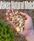 Hand holding mulch from Corded Electric Wood Chipper Shredder Be The Yard Boss With 1.7 Inch Capacity And 15 Amp Motor