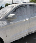 Car covered in foam from Foam Cannon For SPX Series Pressure Washers With Five Nozzle Tips And One Quarter Inch Quick Connector