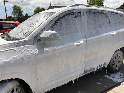Car covered in foam from Foam Cannon For SPX Series Pressure Washers With Five Nozzle Tips And One Quarter Inch Quick Connector