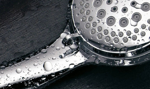 Close-up of Three Way Shower Combo With No-Drill Instant Mount Slide Bar, Overhead And Handheld Heads, stainless steel with water droplets.