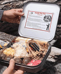Person holding All In One 100 Piece Fire Starter Kit For Campfires And Survival With Ferro Rod 3000F Sparks Wax Ropes open tin.