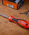 Quarter Inch Drive Dual Material Bit Holding Screwdriver Handle with ergonomic balance on workbench