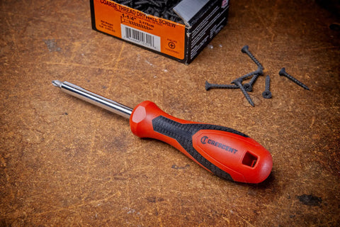 Quarter Inch Drive Dual Material Bit Holding Screwdriver Handle with ergonomic balance on workbench