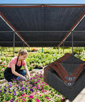 Beefy 70 Percent Shade Cloth For Garden Black Mesh Tarp 6.5 By 10 Feet Outdoor Sun Shade Net showcasing UV blocking in a garden