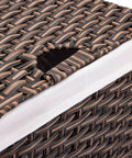 Close-up of a handwoven portable laundry bin in mocha brown with a carrying handle, featuring a water-resistant steel frame.