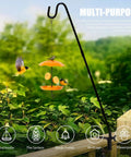 Hella Durable Expandable Deck Hook With A Two Inch Non Slip Railing Mount with bird feeder and birds in garden setting.