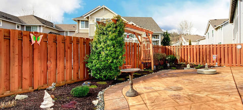Backyard with wooden fence protected by Clear Wood Sealer For Outdoor Projects A Water Based Nano Penetrating Sealant That Waterproofs Decks