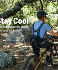 Cyclist wearing Mountain Bike Hydration Pack With 3L Bladder And 10L Storage For Trail Rides, Lumbar Support Design