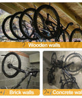 Premium Heavy Gauge Steel Screw In Hooks 12 Pack Hold Your Rig Tight Garage Wall And Ceiling Bike Storage 100 Lb Rock Solid Capacity Black Plant Hangers With Deep Thread Anchors Professional Grade Home Organization bike storage solution on wooden, brick, and concrete walls.