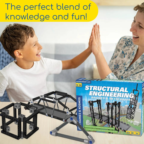 Child and adult high-five with Structural Engineering Kit For Bridges And Skyscrapers box and bridge models, Blue Edition.