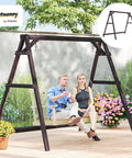 Outdoor setting with Heavy Duty A Frame Wooden Swing Stand With Reinforced Bars, supporting two people, carbonized finish.