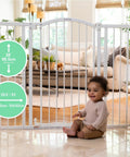 Extra Tall And Wide Safety Gate For Pets And Kids Fits 29 To 53 Inch Openings And Stands 38 Inches Tall No Drill Or Hardware Needed Mount On Wall Or Banister In Doorways Or Stairways Auto Close Walk Through Door installed in doorway with child sitting nearby