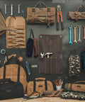 Heavy Duty Waxed Canvas Tool Roll Bag With 24 Pockets Roll Up Pouch For Wrenches And Tools Waterproof 16oz Canvas displayed on pegboard