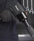 One Inch Drive Air Impact Wrench Packs Ball Bearings And Aluminum Body pumping twisting force with a gloved hand.