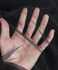 Close-up of a hand behind black polyester hexagonal mesh, showcasing Dope Black Hexagonal Mesh Mosquito Netting For Balcony And Patio.