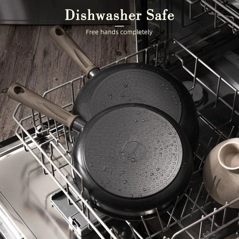 Nonstick Titanium 19 Piece Pots And Pans Set For Induction Cooktops No Fuss Cleanup in dishwasher, showing water droplets on pans