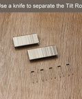 Forty Piece Zinc Plated Iron Louver Staple Kit For Standard Plantation Shutters Featuring Tough Rust Resistance And Straight Up Perfect Tilt Rod Alignment, showing zinc clips on wood background.