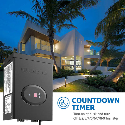 200W Low Voltage Landscape Transformer With Timer And Photocell Sensor Waterproof Ideal For LED Landscape Lighting Path Lights And Outdoor Spotlights From 120V To 12V ETL Listed shown with countdown timer against house at night.