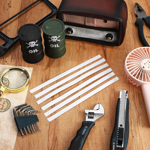 Pro Grade Twenty Pack Reflective Tachometer Tape Strips For Optical And Laser Tachometers on wooden surface with tools