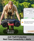 Man lifting LiDAX Ultra 3000 All Terrain Robotic Lawn Mower with phone app interface showing real-time alerts.