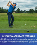 Golfer practicing swing with 130A Golf Launch Monitor With Doppler Radar on a lush green course.
