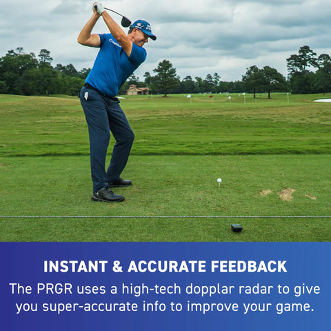 Golfer practicing swing with 130A Golf Launch Monitor With Doppler Radar on a lush green course.