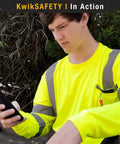 Men High Visibility Class Three Safety Shirt Orange Breathable Polyester Mesh Work Rig Gear With Silver Reflective Tape Sleek Cut Built For The Daily Hustle 2xl worn by a man while using a phone.