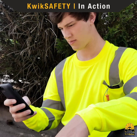 Men High Visibility Class Three Safety Shirt Orange Breathable Polyester Mesh Work Rig Gear With Silver Reflective Tape Sleek Cut Built For The Daily Hustle 2xl worn by a man while using a phone.
