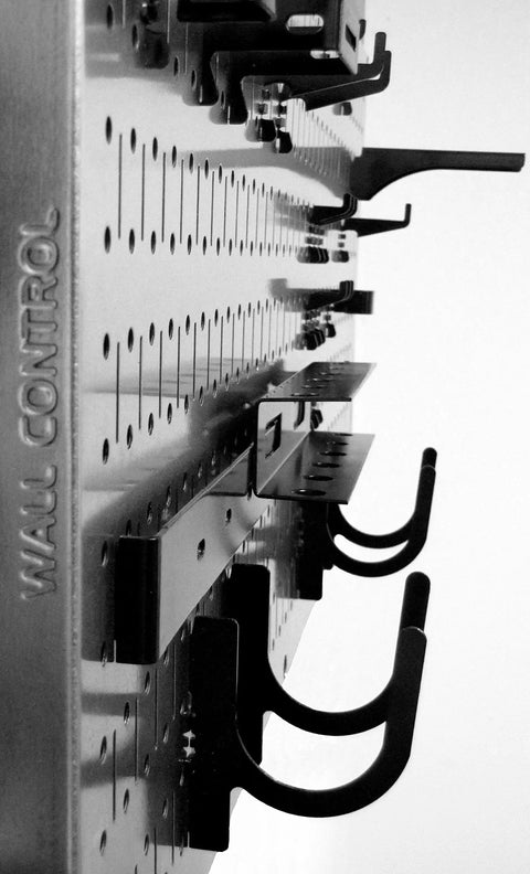 Close-up of Three Pack Pegboard Set, 16 Inch Tall By 32 Inch Wide Steel Wallboards with hooks and slots for tool storage.