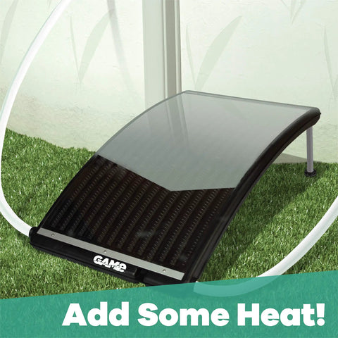 Curved solar pool heater panel on grass with hoses connected, designed to increase pool water temperature efficiently.