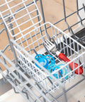 White Coated Steel Cabinet Organizer Basket With Snap Lid holding items in dishwasher, showcasing durability and storage function.