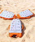 Spearfishing Float Buoy With Foldable Carbon Fiber Flagpole And D Ring Handles Built In Fish Measuring Ideal For Freediving Snorkeling Rescue And Underwater Sports Orange Red, three buoys on sand