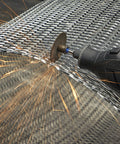 Rotary tool with a 1.5-inch cut-off wheel cutting metal mesh, sparks flying.