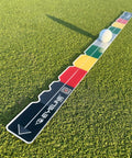 Stroke Meter 2.0 Putting Aid for Stroke Length, Speed, and Distance Control on outdoor green surface with golf ball nearby