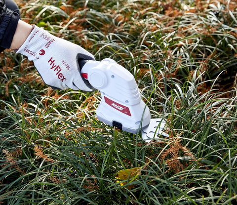 Cordless 2 In 1 Grass And Shrub Shear With Seven Point Two Volt 2000mAh Battery Delivers 1300 Cuts Per Minute being used on grass