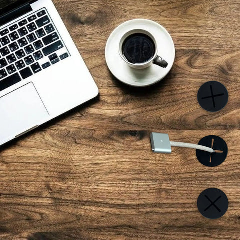 18 Pack Flexible Silicone Desk Cable Grommets With 1 Inch Hole Saw Heavy Duty Cord Hole Covers For Office Tables And Wall Panels Black on a wooden desk with a laptop and coffee.