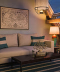 Elaine Table Lamp With Antique Mercury Glass And Brushed Steel Finish in cozy living room setting