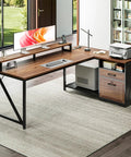 L Shaped Desk With Wood Drawers And Locking File Cabinet, 61 Inch Corner Office Desk With Power Outlet, LED Monitor Stand And CPU Stand, Under Desk Shelf Storage, Walnut Finish For A Boss Level Home Office Setup with printer and books on desk