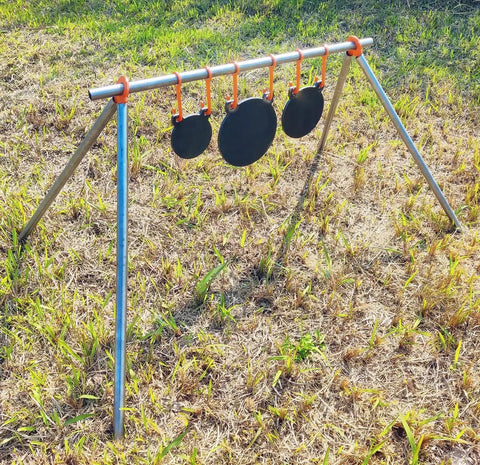 AR500 Steel Target Gong Silhouette For Precision Shooting, Half Inch Thick, Rifle Rated, on stand in grassy outdoor setting