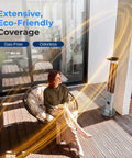 Outdoor Electric Patio Heater With Remote Control 900W Infrared Heat For Instant Warmth Aluminum Reflector IP65 Weatherproof Quiet Standing Porch Heater For Patio And Backyard Ideal For Cold Nights And Chill Evenings next to a seated woman on a patio.